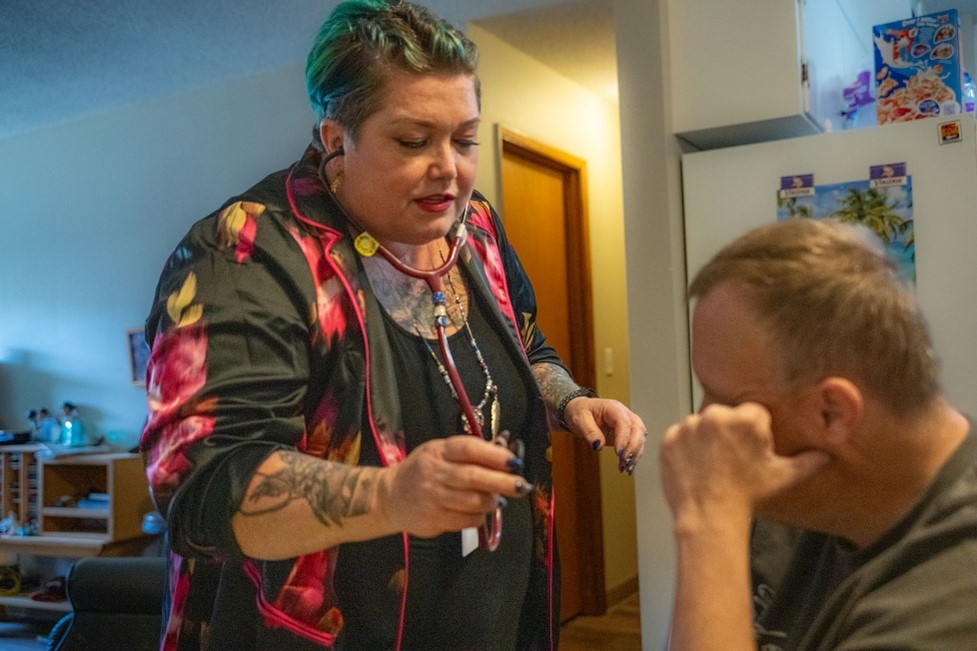 A woman treating a person